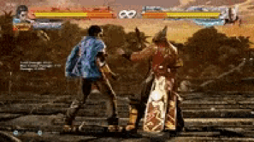 two men are fighting in a video game and one of them is wearing a blue jacket .
