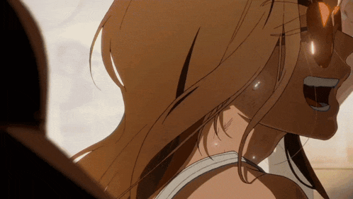 a close up of a woman 's face with a smile