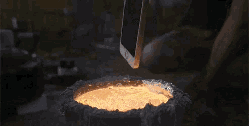 a candle is lit up in a dark room