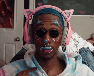 a man wearing a pair of pink cat ear headphones and sunglasses