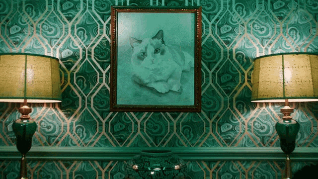 a grumpy cat is framed on a green and gold wallpaper