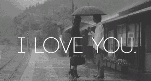a black and white photo of a man and a woman under an umbrella with the words i love you below them