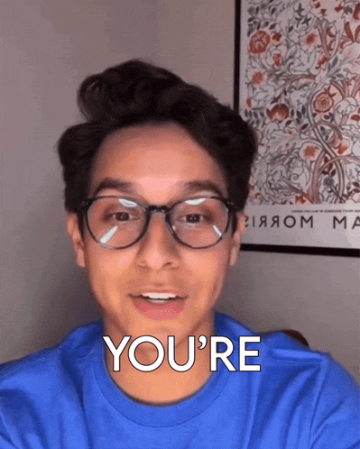 a young man wearing glasses says you 're
