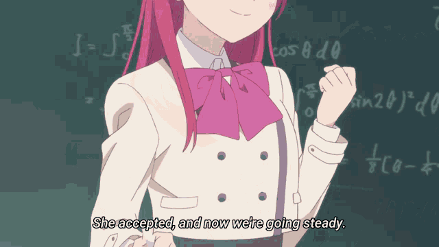 a girl with red hair says she accepted and now we 're going steady in front of a blackboard