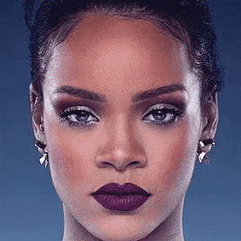 a close up of a woman 's face with purple lipstick