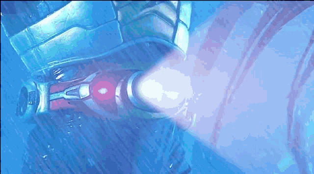a close up of a person 's arm with a flashlight on it .