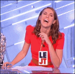 a woman wearing a red shirt with le jt on it laughs