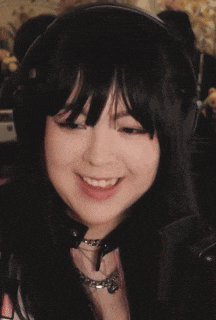 a woman wearing headphones says i 'm very smart on her face