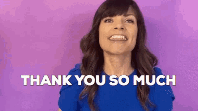 a woman in a blue shirt is smiling and saying thank you so much