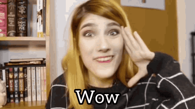 a woman is making a surprised face and the word wow is on the bottom of her face