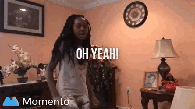 a girl is dancing in a living room with the words oh yeah written on the bottom