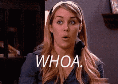 a woman with a surprised look on her face and the words whoa written on her face .