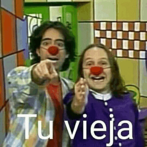 a man and a girl with red noses pointing at the camera .