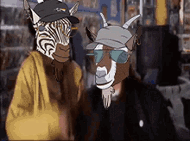 a zebra and a goat are standing next to each other .