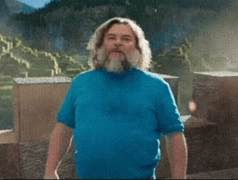a man with a beard wearing a blue shirt