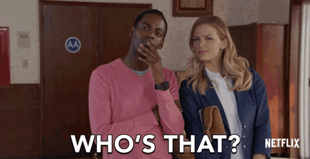 a man in a pink sweater is covering his mouth while standing next to a woman who says who 's that netflix