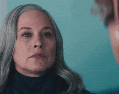 a woman with gray hair is looking at a man and the words right are above her