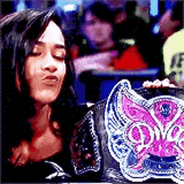 a woman is holding a butterfly shaped purse and making a face .