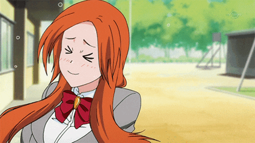a girl with red hair and a red bow tie is smiling