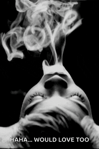 a black and white photo of a woman with smoke coming out of her mouth with the caption " haha would love too "