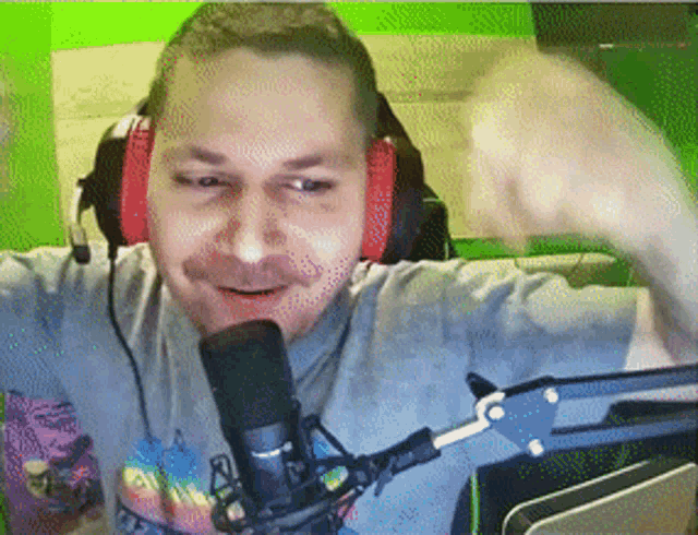 a man wearing headphones and a t-shirt that says ' rainbow ' on it
