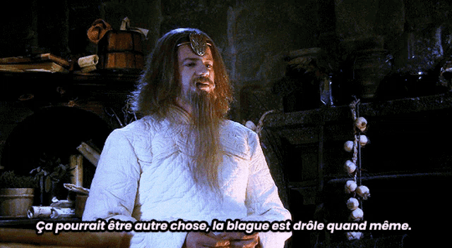 a man with long hair and a beard says " ca pourrait etre autre chose "