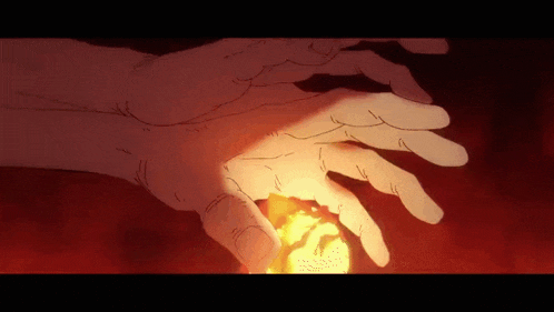a close up of a person 's hand with a fireball in it