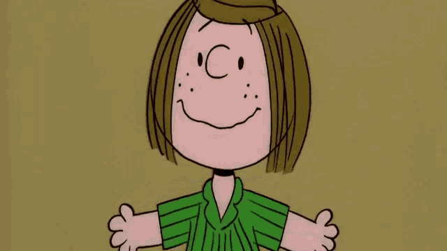 a close up of a cartoon character wearing a green shirt with a c on her face .