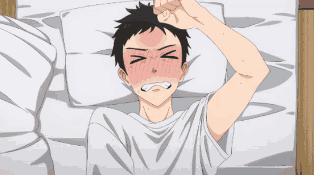 a boy with his eyes closed and his hand on his forehead