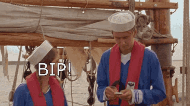 a man and a woman standing next to each other with the word bip on the bottom