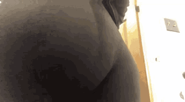 a close up of a person 's butt in a black pants .
