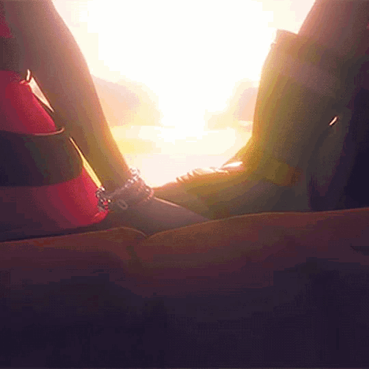 a woman in a red dress is sitting on a couch
