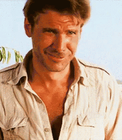 a close up of a man wearing a white shirt