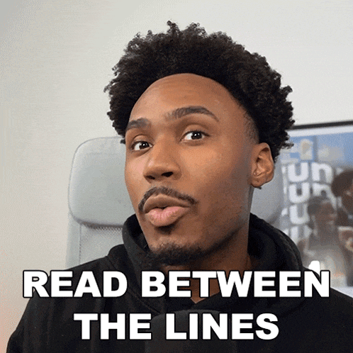 a man is reading between the lines and making a face