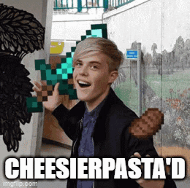 a young man is holding a piece of cheese and the caption says cheeseierpasta d