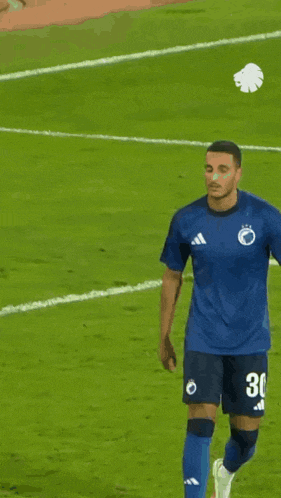 a soccer player with the number 30 on his shirt