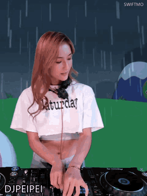 a woman in a saturday shirt playing music