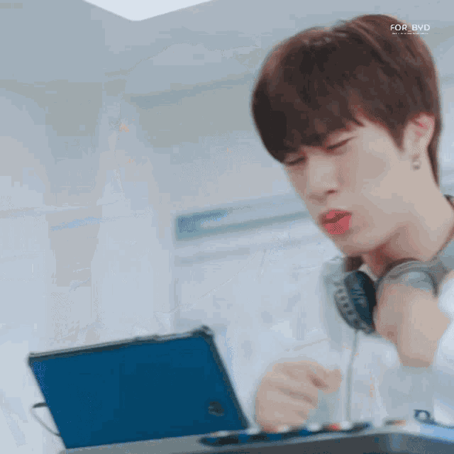 a man wearing headphones and a shirt that says cavish design