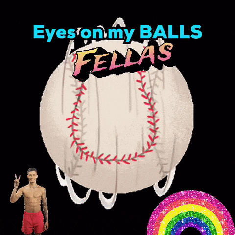 a shirtless man stands in front of a fellas ball