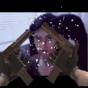 a person holding a gun in front of a woman