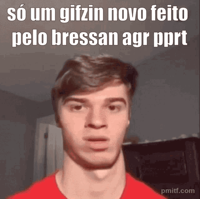 a man in a red shirt is making a funny face