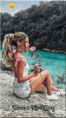 a woman is sitting on a rock holding a flower with the words have a nice day written below her