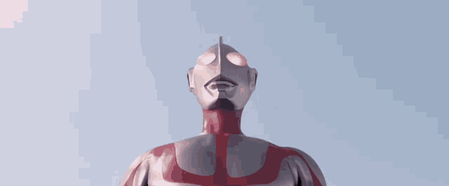 a close up of a person 's legs in a red and white suit against a blue sky .