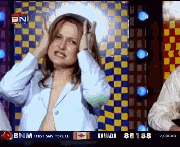 a woman covering her ears in front of a checkered wall with bnm text sms poruke canada and 82188