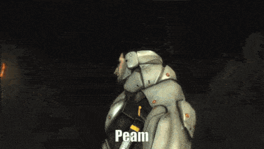 a man in a futuristic suit says peaam in front of a fire