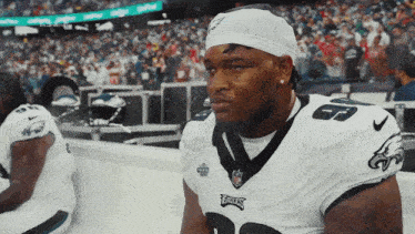 a philadelphia eagles player sits on the sidelines during a game