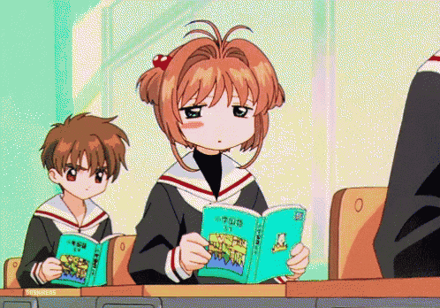 a girl in a school uniform is reading a book with chinese writing