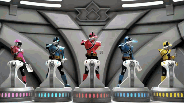 a group of power rangers are standing next to each other on a stage