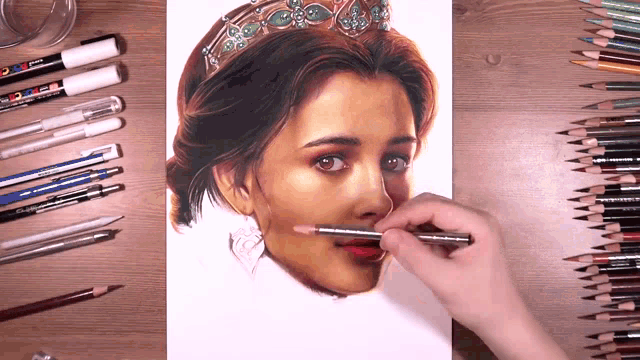 a drawing of a woman with a crown on her head is being completed