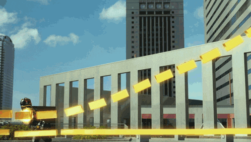 a building with a lot of windows and a yellow line going up